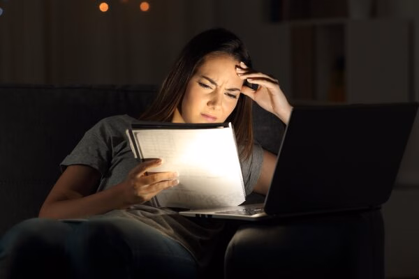 young person awake at night doing homework